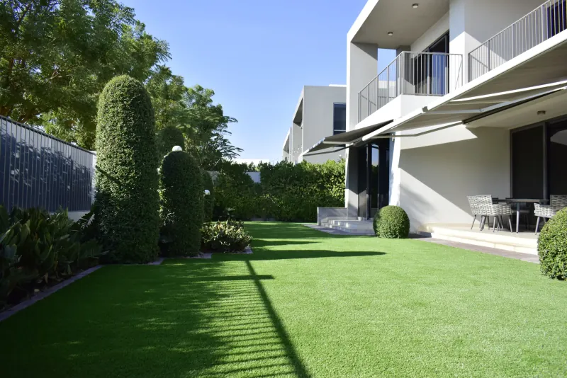 A Maze Grass lawn in a Dubai Hills villa garden